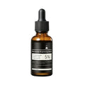 Woman applying Skinoralabs face serum for radiant healthy-looking skin